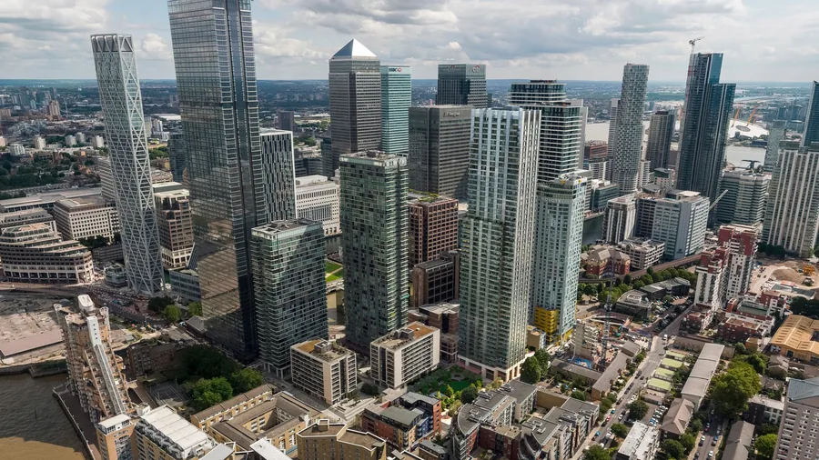 Aerial visualisation of the Cuba Street tower rising beside Canary Wharf on the Isle of Dogs.