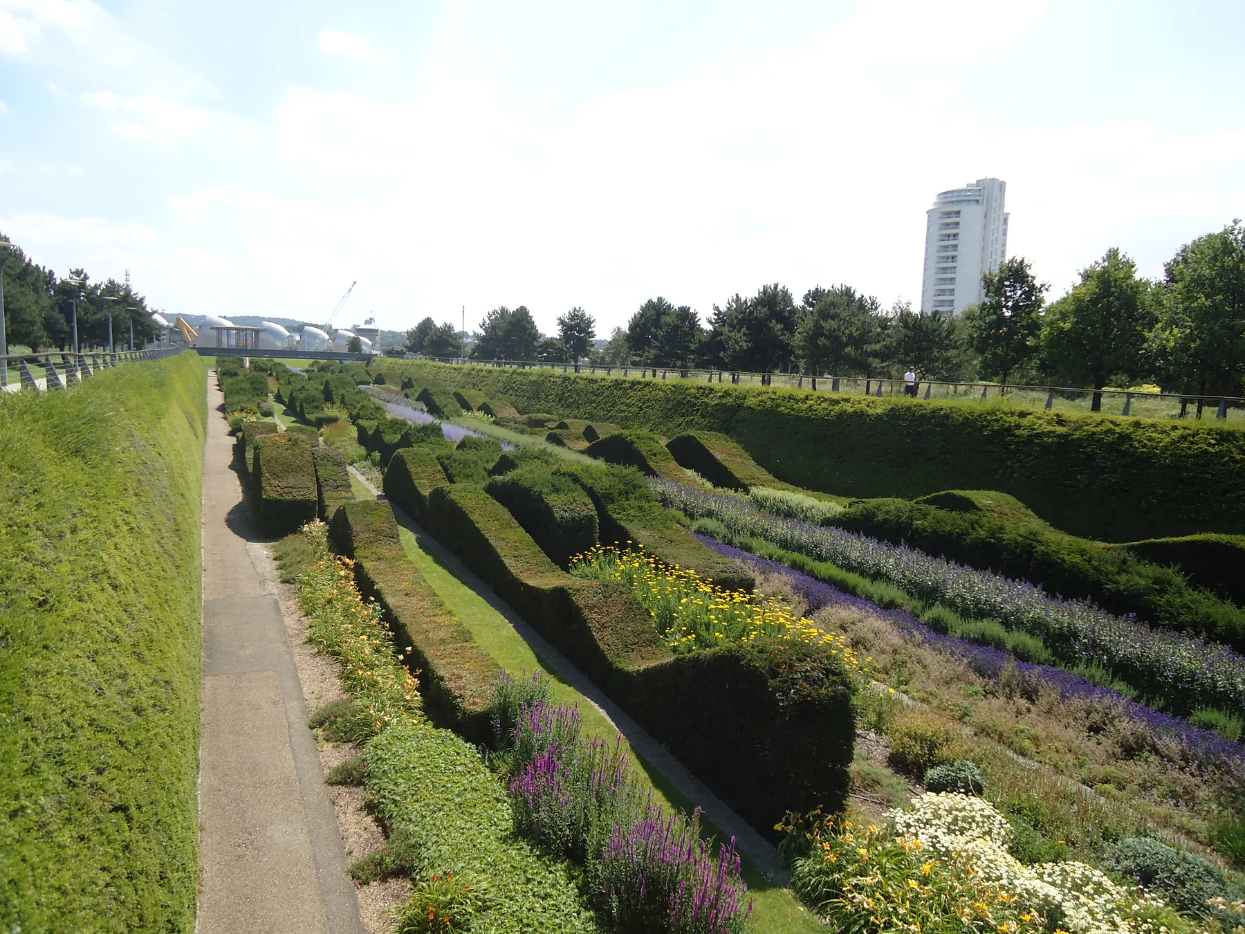 The sunken garden and riverside walk at Thames Barrier Park in the Royal Docks, east London.