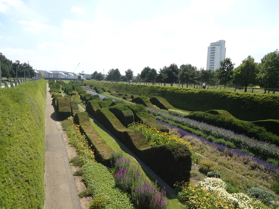 The sunken garden and riverside walk at Thames Barrier Park in the Royal Docks, east London.